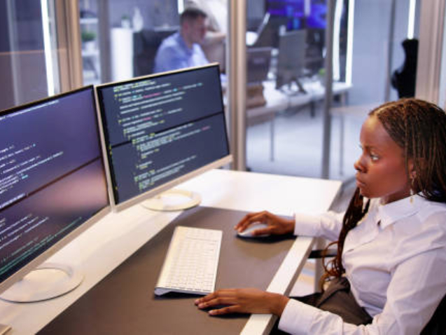 Software Programmer Or Coder Woman Using Office Computer
